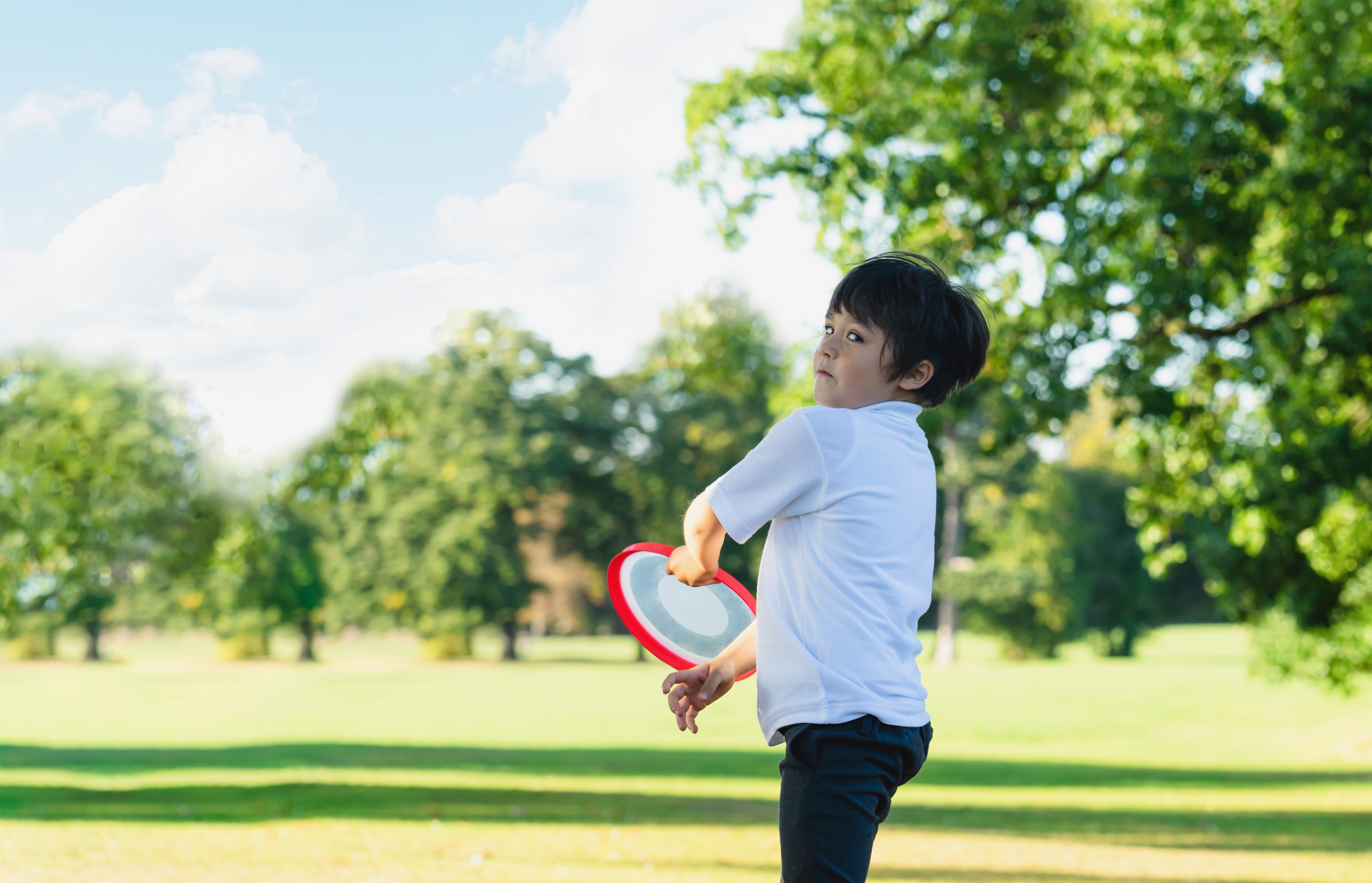 Portrait Of Happy School Kid Playing In The Park, Child Having F